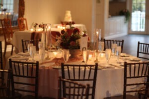 Elegant wedding reception table setup at Antrim 1844 featuring formal place settings, linens, and floral centerpiece décor.