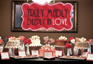 Wedding cakes displayed in a romantic setting with the phrase “Truly Madly Deeply in Love” written across the image.